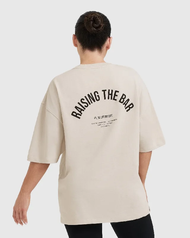 Raising The Bar Graphic Unisex T-Shirt | Sand